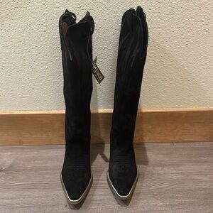 Women’s black suede cowboy boots with lightening bolts.